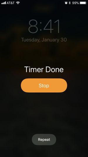 On the iOS lock screen, the Timer’s primary option is Stop, secondary option is Repeat.
