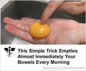 An ad with a photo of what appears to be a large egg yolk sitting on a person’s open palm, being poked by a finger from their other hand. The headline beneath the picture reads, “This Simple Trick Empties Almost Immediately Your Bowels Every Morning,” followed by much smaller text reading, “Sponsored by Guthealthwellness.” To the left of the logo is a symbol resembling the caduceus, but with the wings replaced by leaves.