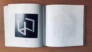 Incomplete Open Cubes book spread with a seven-part cube