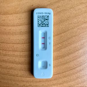 A rapid antigen test showing a positive result