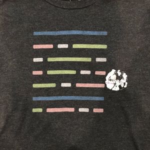 A T-shirt with the remnants of an I Voted sticker stuck to it.