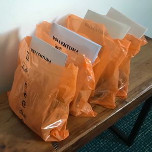 Plastic bags filled with IKEA hardware and instruction manuals