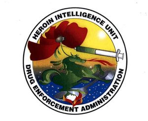 The Heroin Intelligence Unit patch shows a syringe extracting heroin from a poppy plant above a fire-breathing horse heating a spoon.